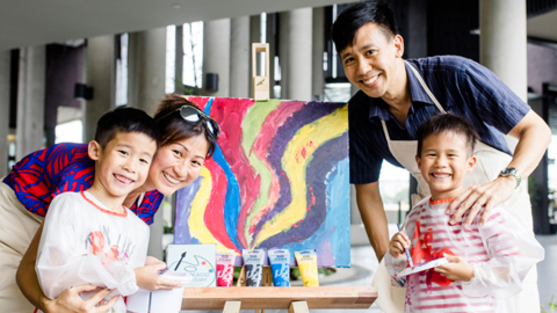 A family enjoys painting at D'Resort Singapore